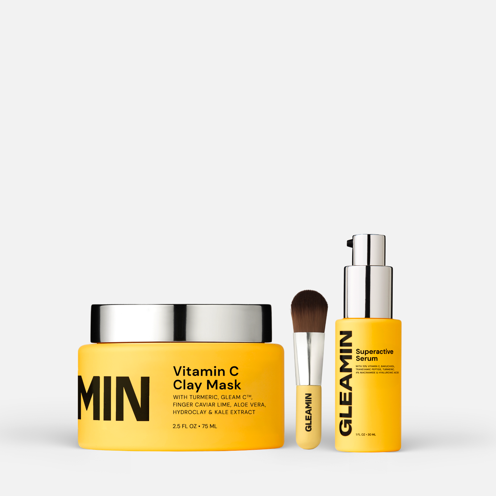 Dark spot corrector set featuring GLEAMIN Vitamin C Clay Mask, Superactive Serum, and applicator brush for radiant skin