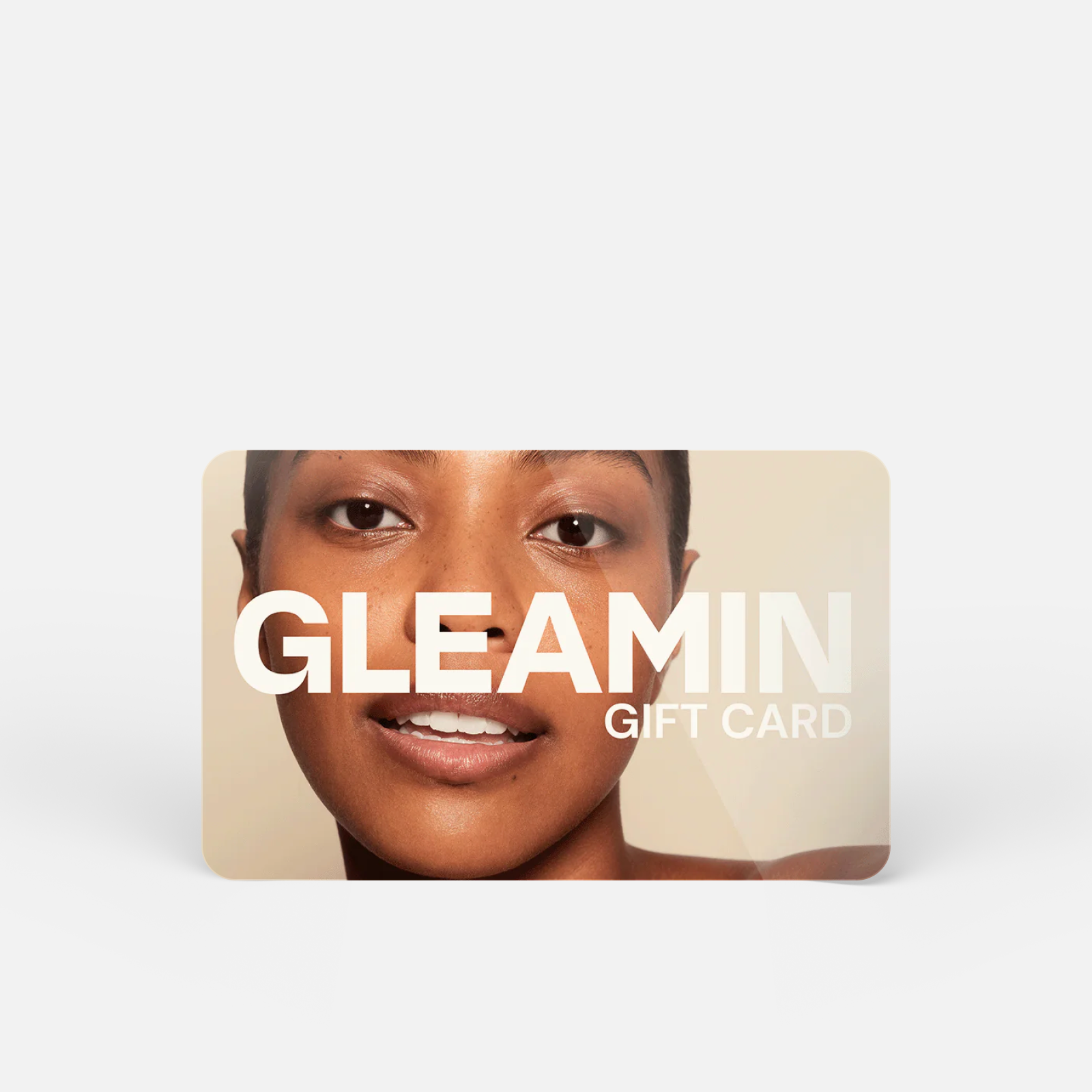 Gift card featuring close-up of smiling woman with clear skin and bold GLEAMIN branding across the front