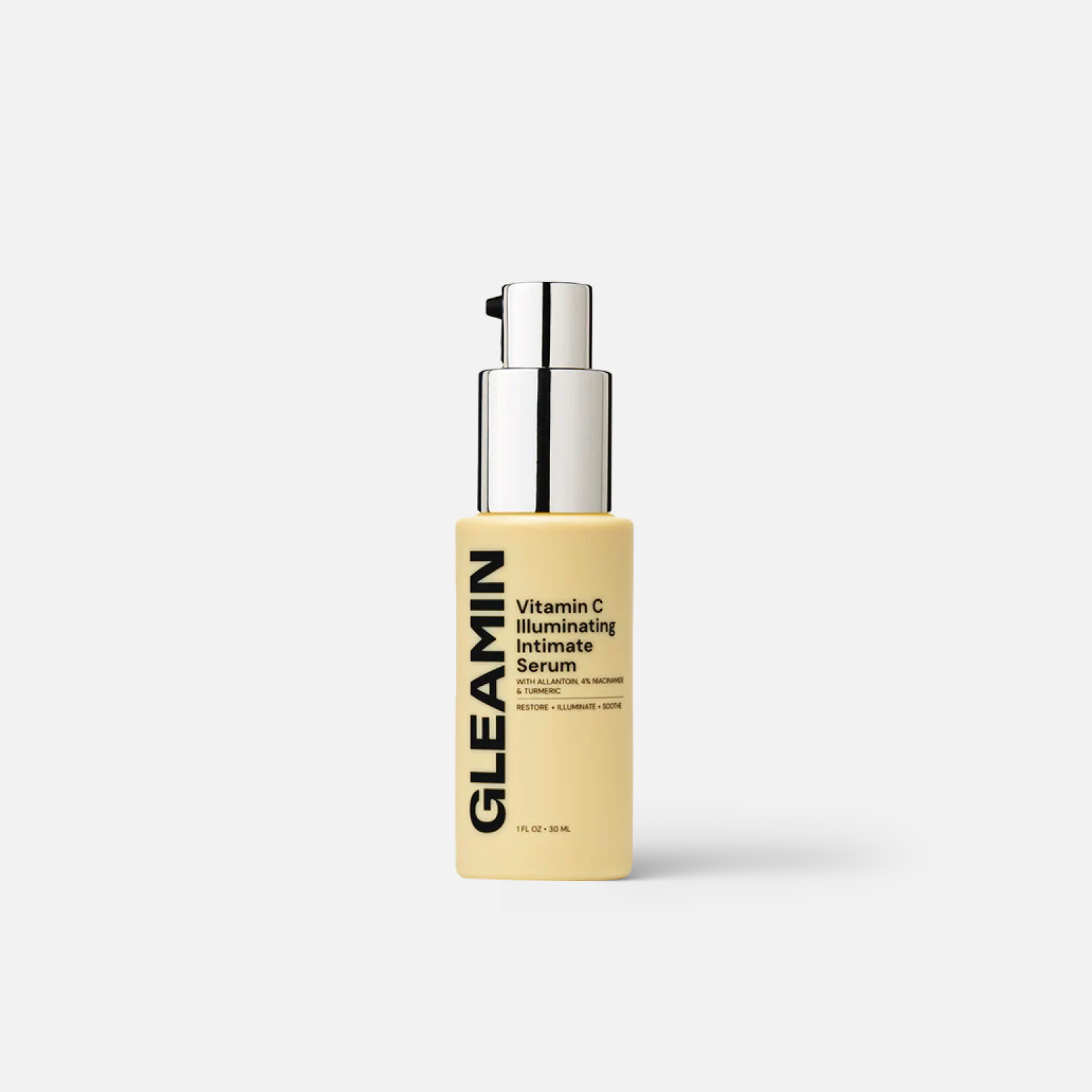 Brightening serum in sleek yellow bottle labeled GLEAMIN for soothing and illuminating skin