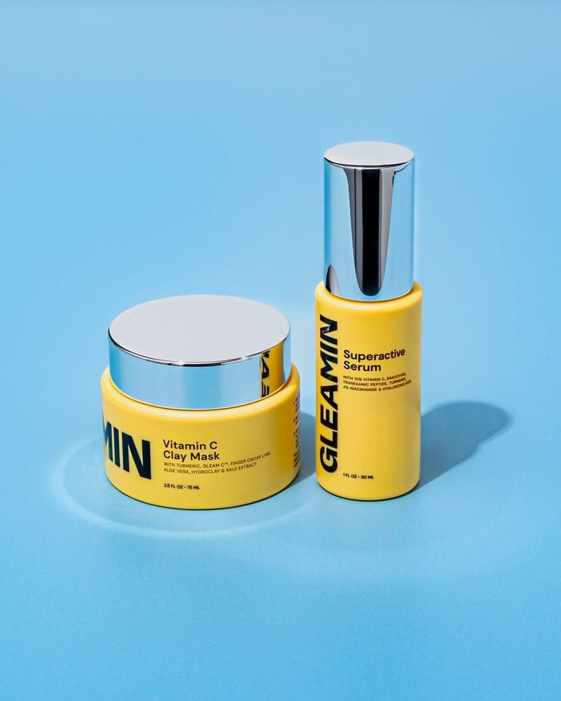 Superactive Serum and Vitamin C Clay Mask on a blue backdrop
